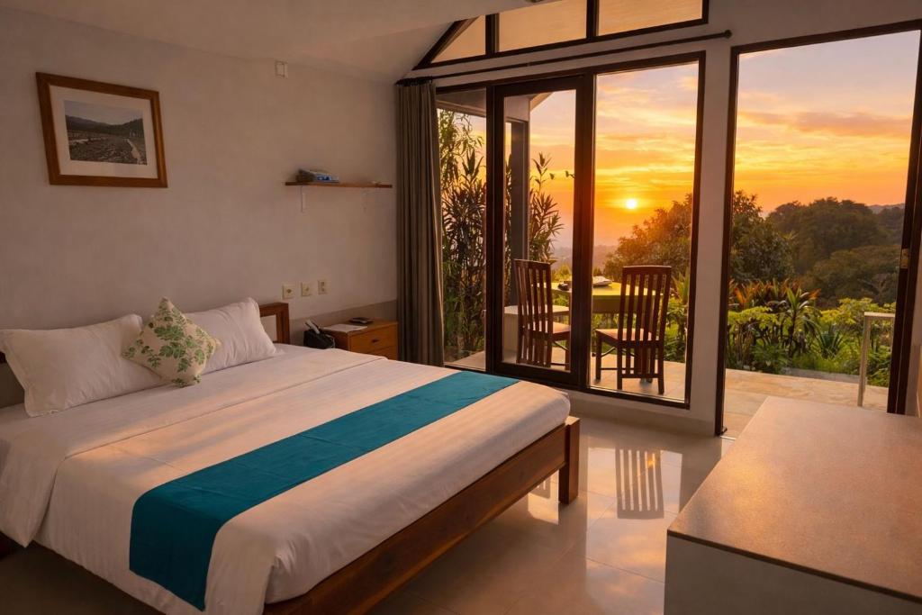 a bedroom with a bed and a balcony with a sunset at Munduk Clove in Munduk