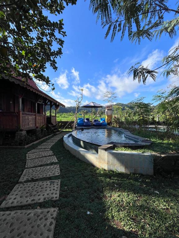 a small pool in the yard of a house at Green labak 2 in Silebeng