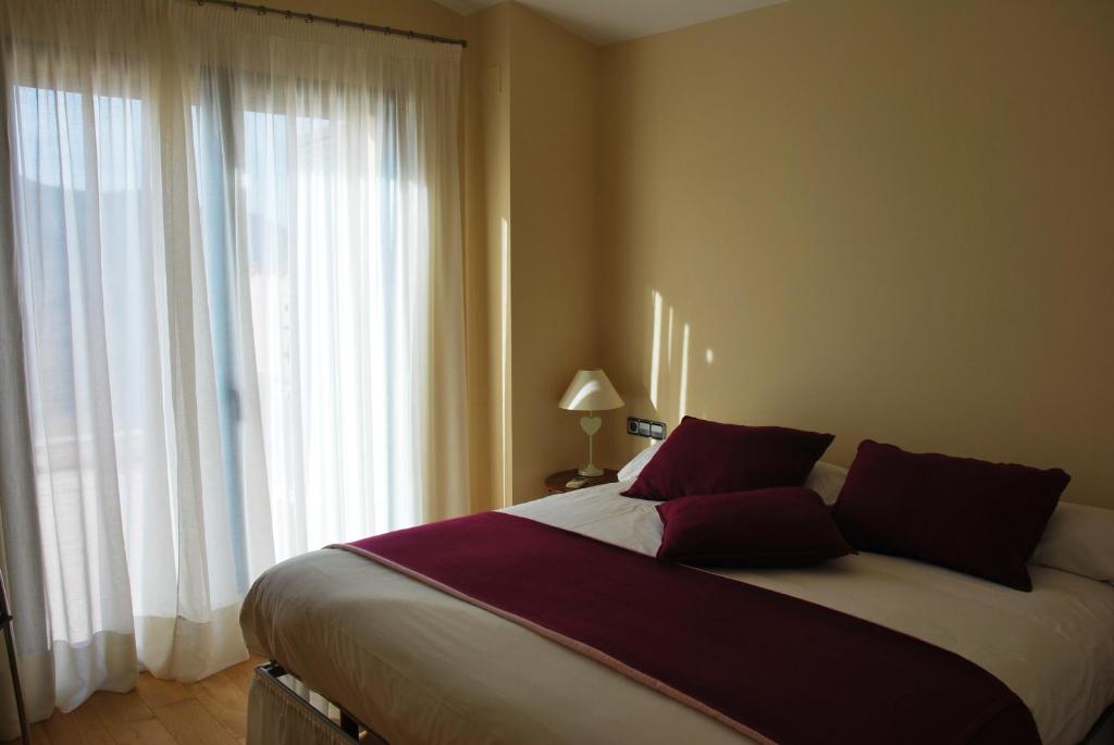 Posteľ alebo postele v izbe v ubytovaní Buil & Gine Wine Hotel