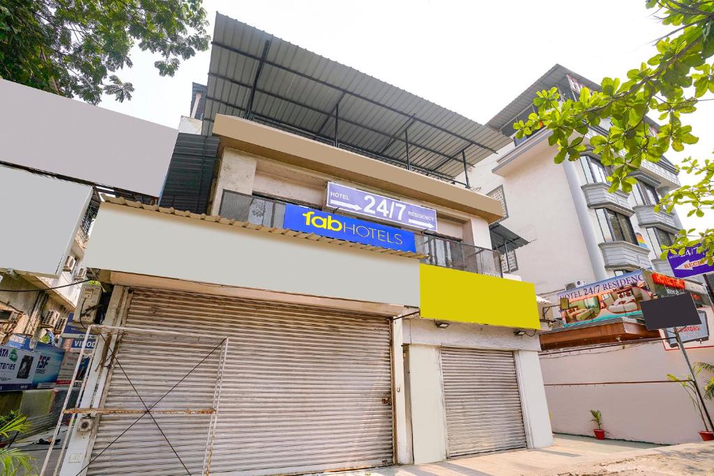 a building with a garage door in front of it at Via 24x7 in Mumbai