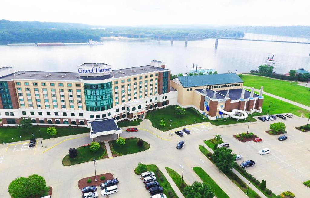 an aerial view of the grand hotel with a river at Grand Harbor Resort in Dubuque