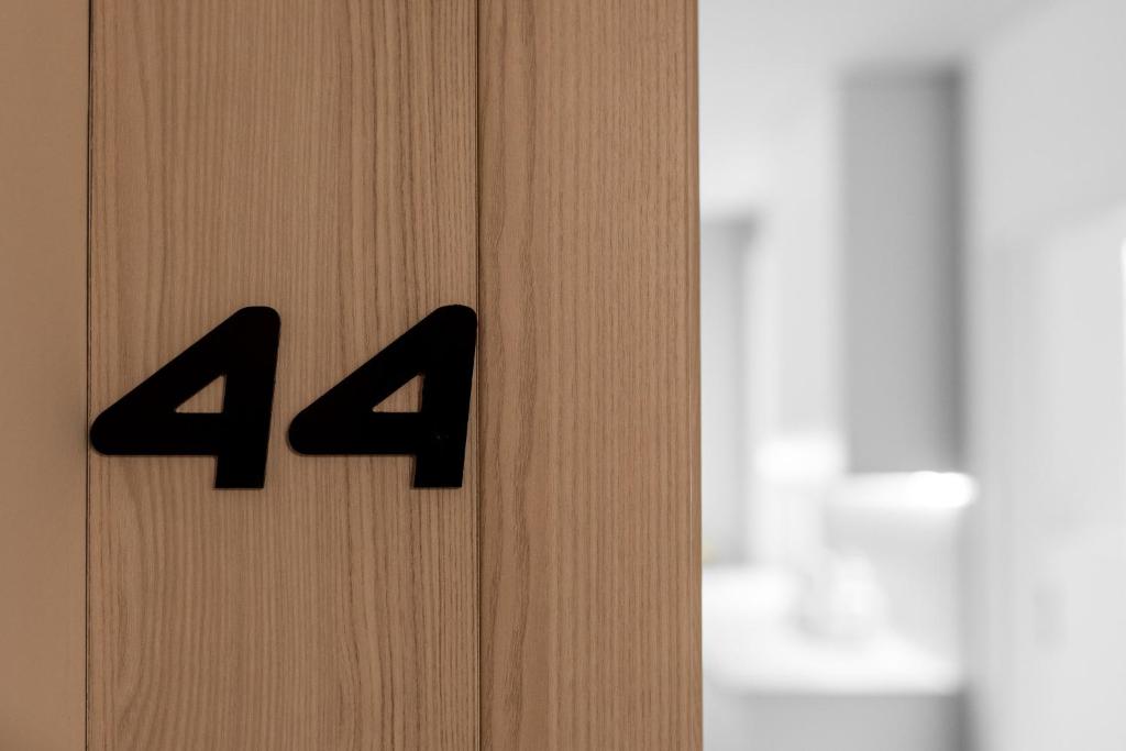 a close up of a door with the number on it at Apartament 44 - Bliżej morza in Kołobrzeg