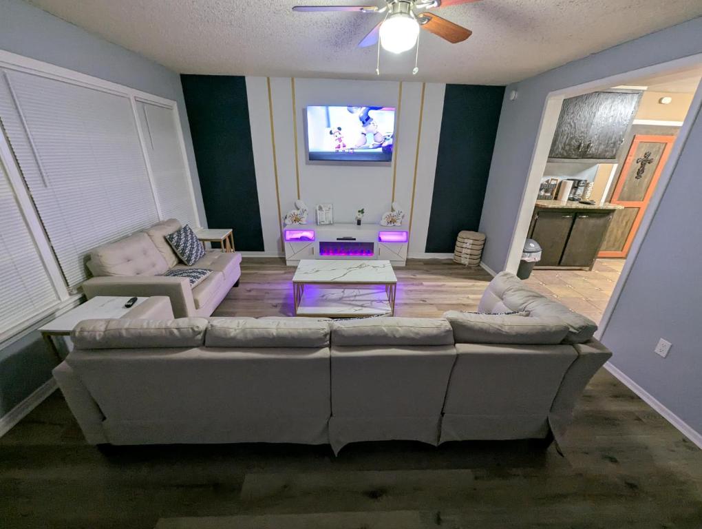 a living room with a couch and a tv at Fresh start small breakfast cook and serve your self in Lubbock