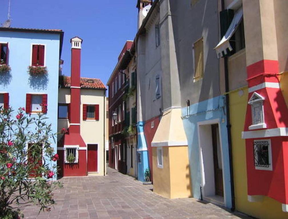 a group of buildings on a street at Suite In Centro Storico in Caorle