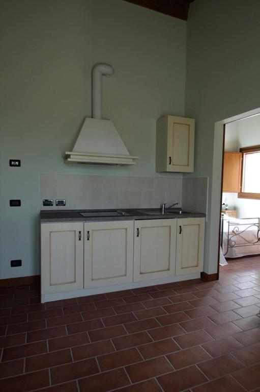 Kuchyň nebo kuchyňský kout v ubytování Corte Stellata Holiday Apartments