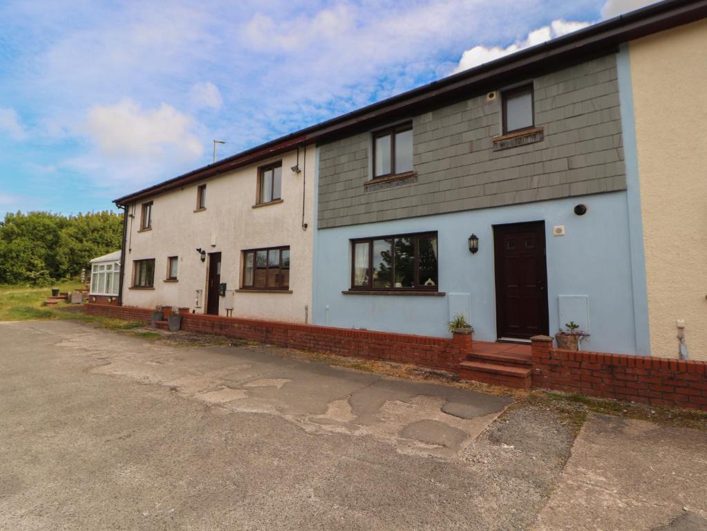 a large white house with a lot of windows at Valley View in Cleator Moor