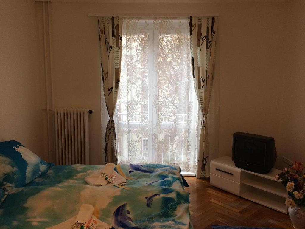 Posteľ alebo postele v izbe v ubytovaní Írisz Apartman Budapest