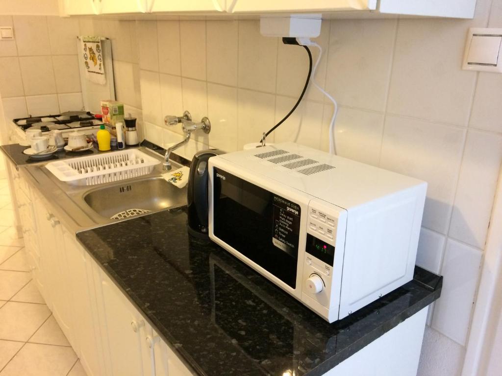 Kuchyňa alebo kuchynka v ubytovaní Írisz Apartman Budapest