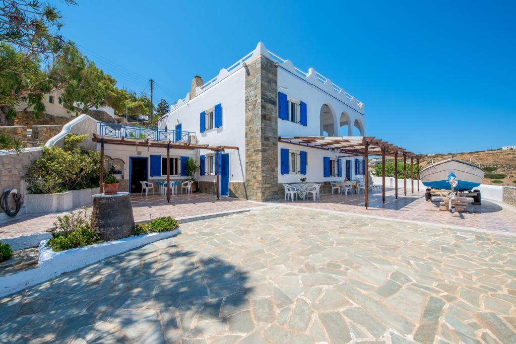 a large building with a patio in front of it at Lotos Suite in Kini
