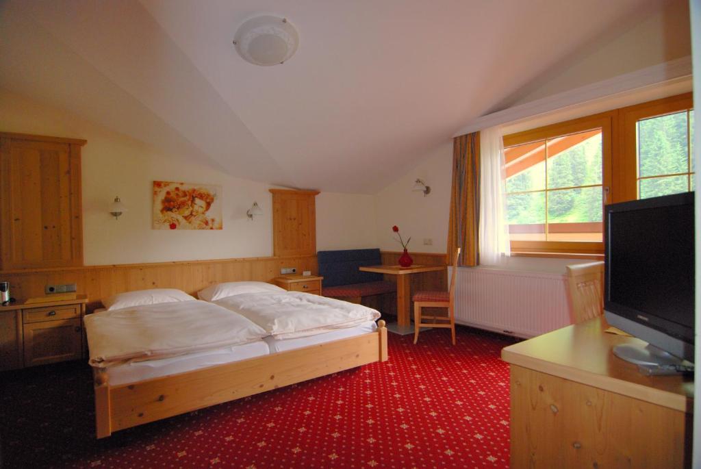 Postelja oz. postelje v sobi nastanitve Hotel Garni Forelle