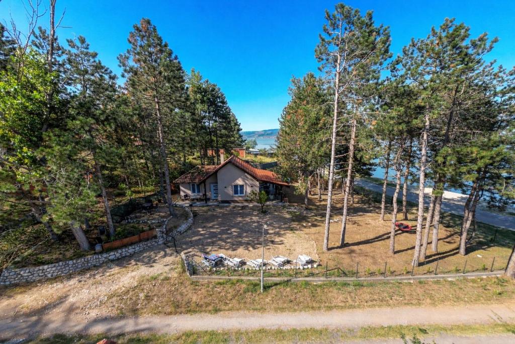 an aerial view of a house in the woods at Borova Bajka - Peace & Privacy by the Danube in Usije