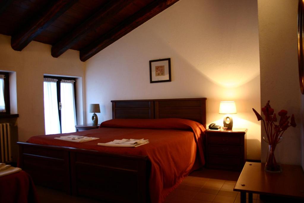 Postel nebo postele na pokoji v ubytování Hotel Ciocca