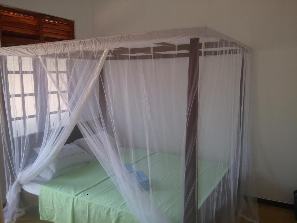 Postel nebo postele na pokoji v ubytování Chithra Homestay