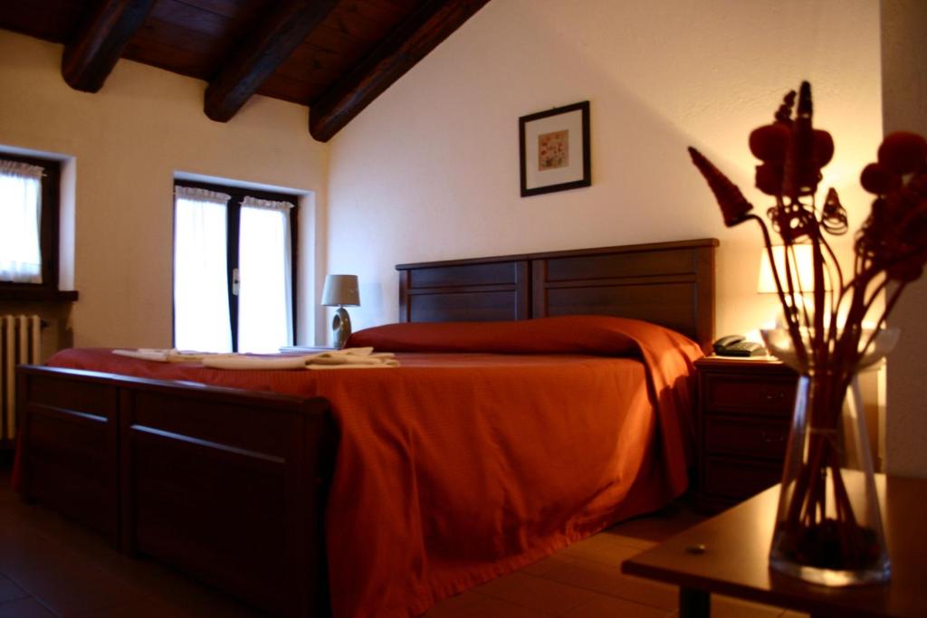 Postel nebo postele na pokoji v ubytování Hotel Ciocca