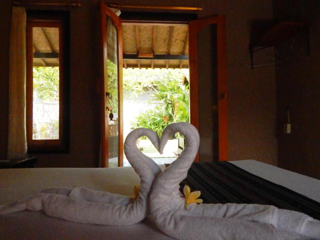 Postel nebo postele na pokoji v ubytování Yuda Menjangan Homestay