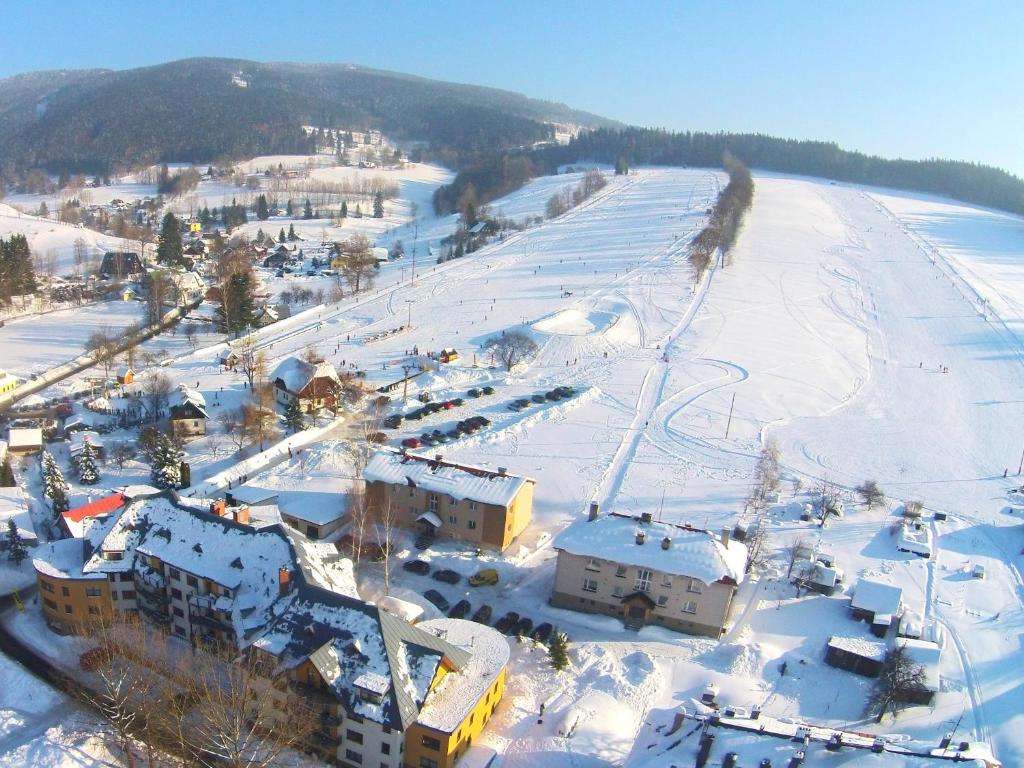 an aerial view of a resort in the snow at Apartmán Rokytka 205 in Rokytnice nad Jizerou