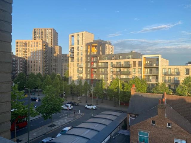 a view of a city with tall buildings and cars at Colindale Central Apartment in Colindale