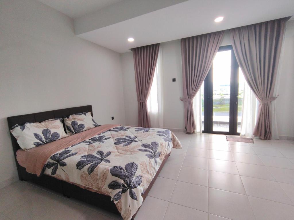 a bedroom with a bed and a large window at 25 Homestay Pulai in Johor Bahru