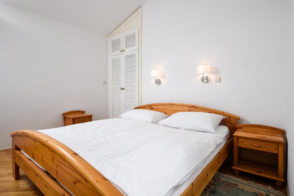 Postel nebo postele na pokoji v ubytování Apartmani Alice