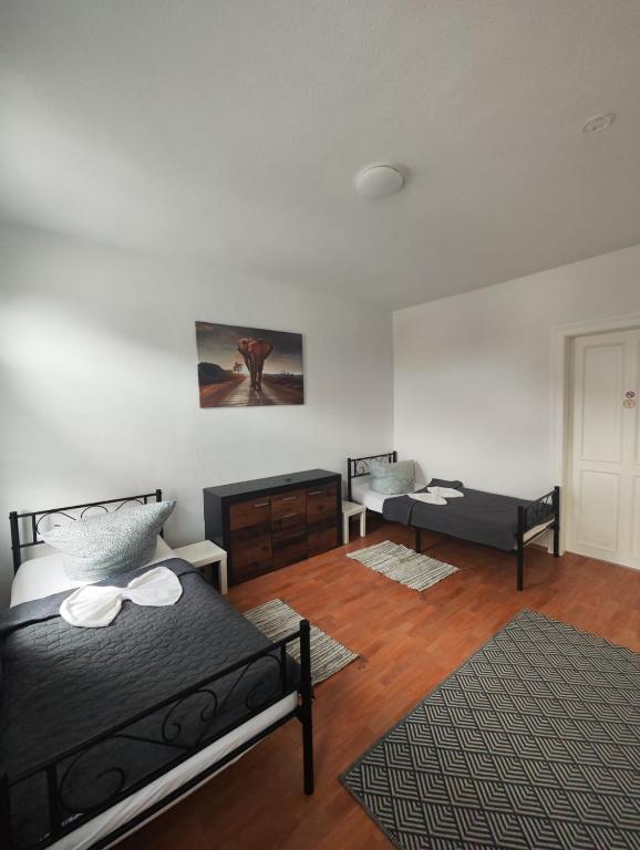 a bedroom with a bed and a desk in it at Revant Monteurzimmer Haus WE 3 in Arnstadt