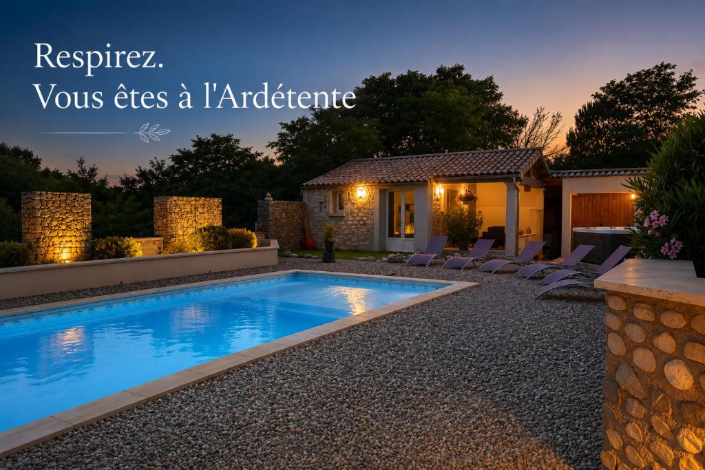a swimming pool in a yard with a house at L'Ardétente - Le cosy, Piscine et SPA en Ardèche, Adults only in Lussas