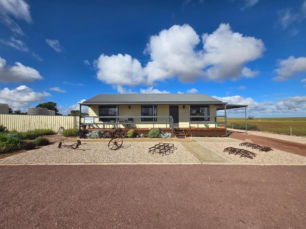 a house with sculptures in front of it at Wudinna Crow's Nest in Wudinna