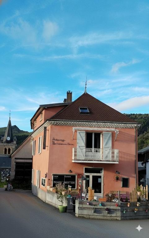 a house with a balcony on the side of it at Auberge Buissonniere in Gresse-en-Vercors