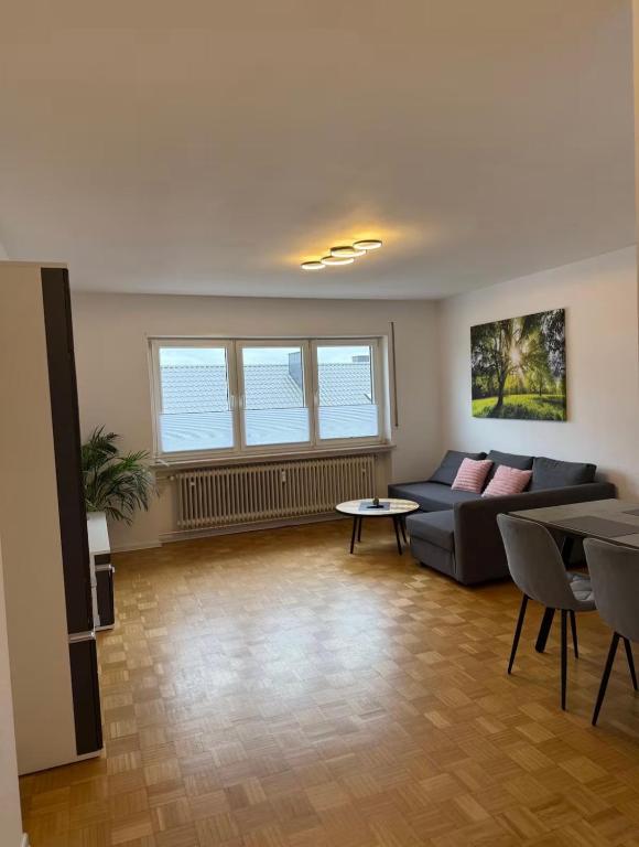 a living room with a couch and a table at Ferienwohnung Klaus in Clausen
