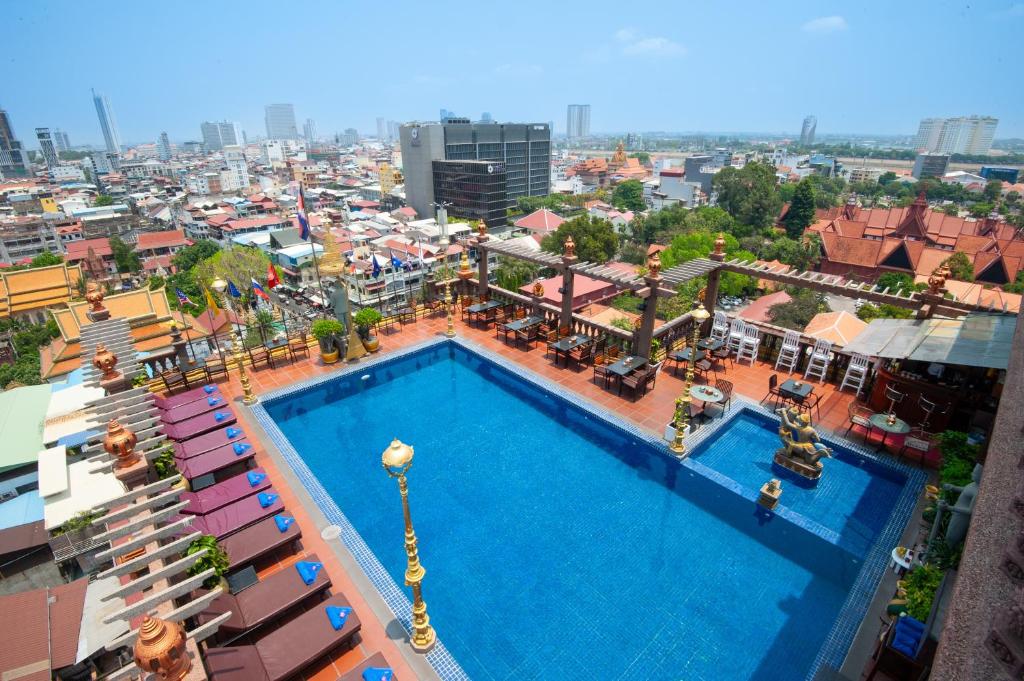 an overhead view of a large swimming pool in a city at Okay Boutique Hotel in Phnom Penh