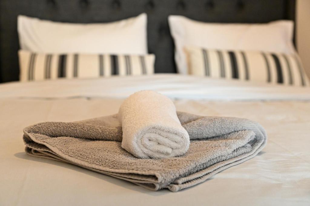 a towel sitting on top of a bed at CALLI HOUSE in Preveza