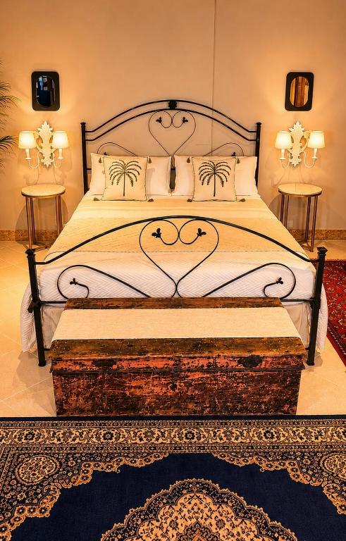 a bedroom with a large bed and a rug at Villa Incanto on the Sea in Syracuse