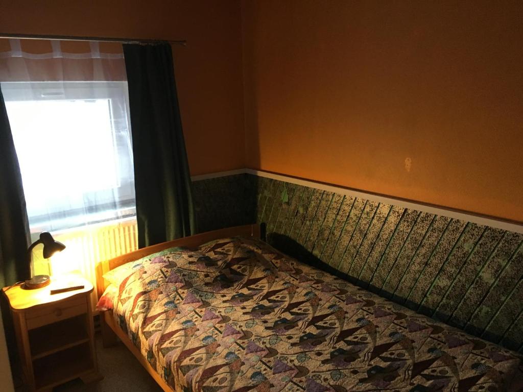 Postel nebo postele na pokoji v ubytování Tolli Hostel & Holiday House