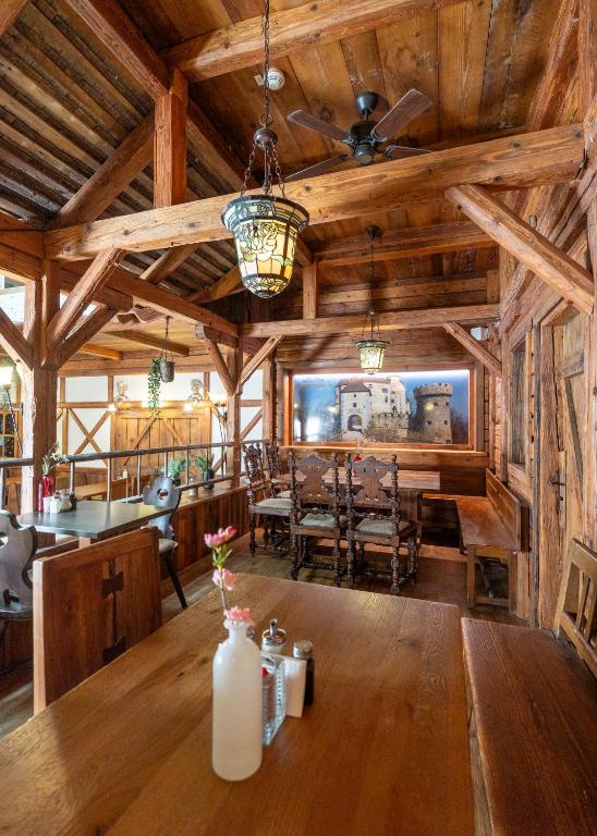 a dining room with a large wooden table in a cabin at Hotel Enziana Wien in Vienna