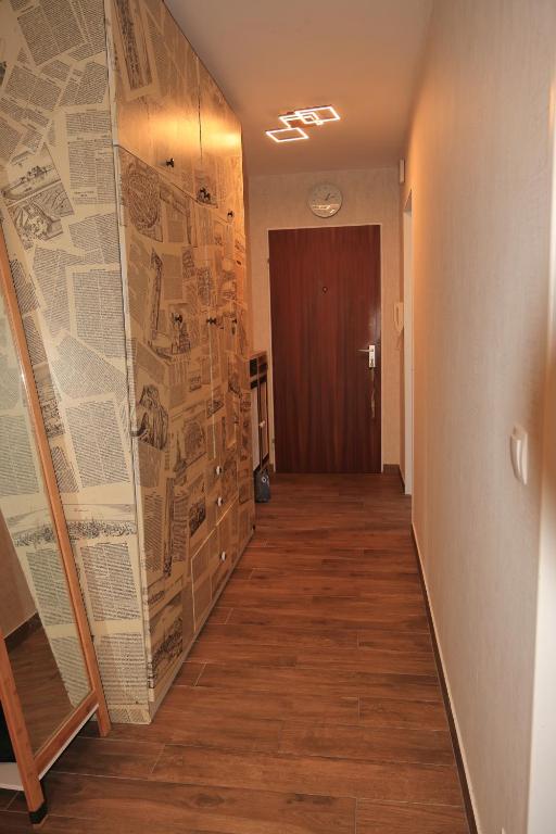 a hallway with a wall with maps on it at Heimathafen Heilbronn in Heilbronn