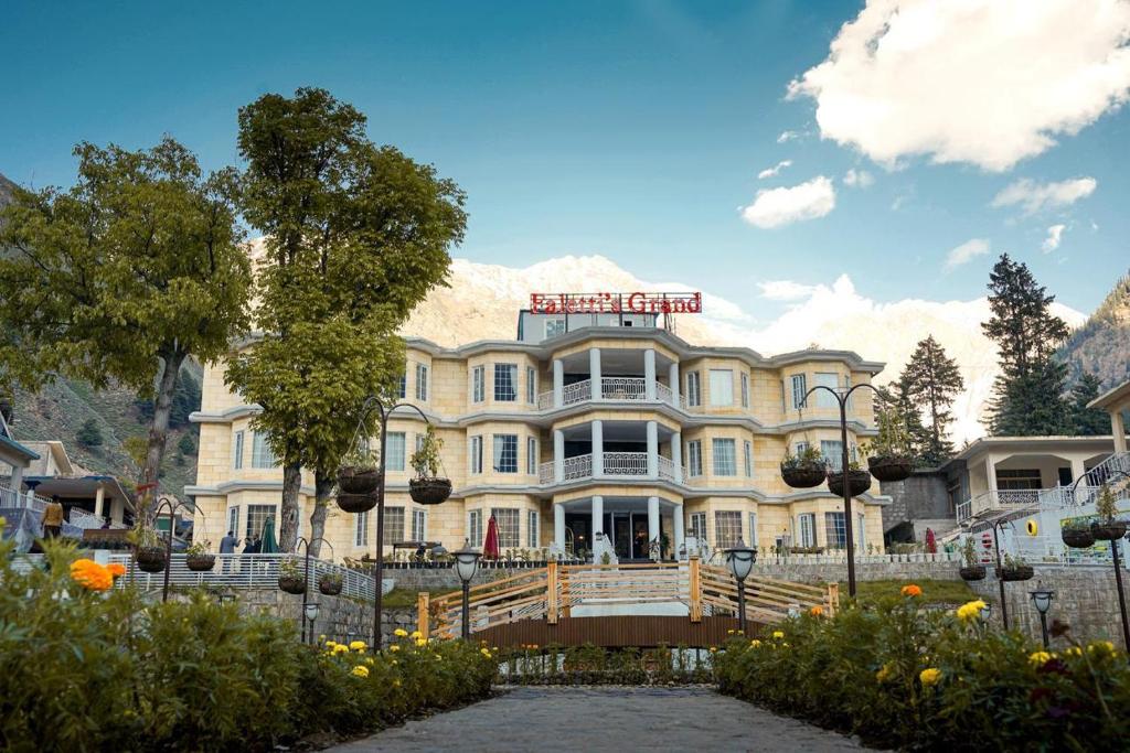 a large building with a sign on top of it at Falettis Grand Hotel Naran in Naran