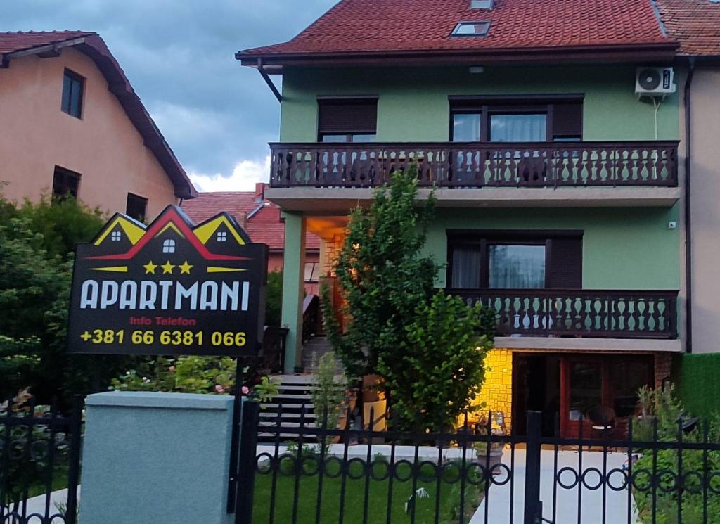 a building with a sign in front of it at Apartmani Varos & Restaurant in Pirot