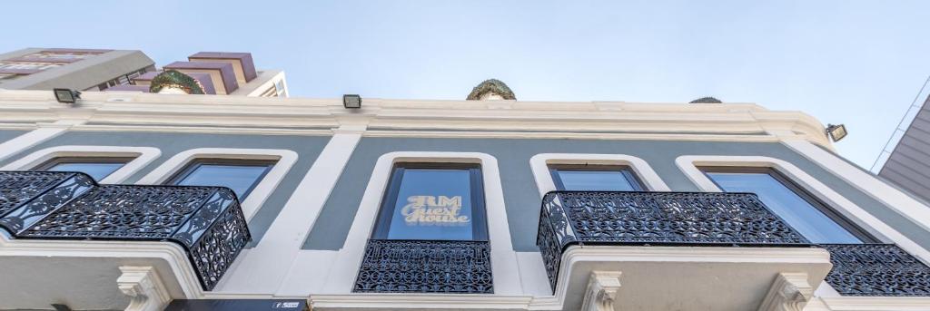 a white building with a sign on the side of it at RM The Experience - Small Portuguese Hotels in Setúbal