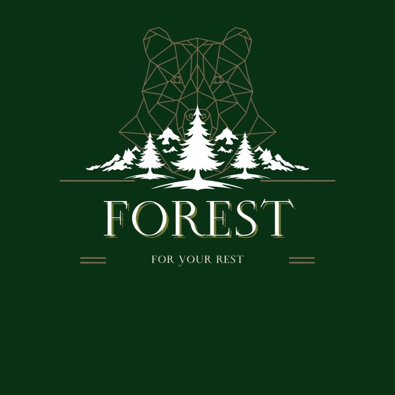 a forest with trees and a bear logo at Forest Guest House in Alaverdi