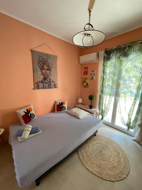 a bedroom with a large bed and a large window at Apartment Bella 2 Perea in Perea