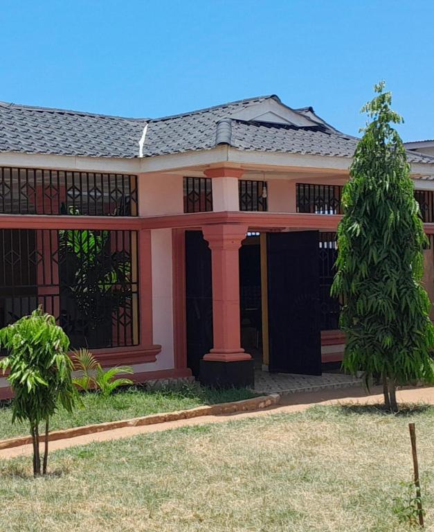 a rendering of a house with a tree at Ngalula Half London Resort in Dzitsuhe