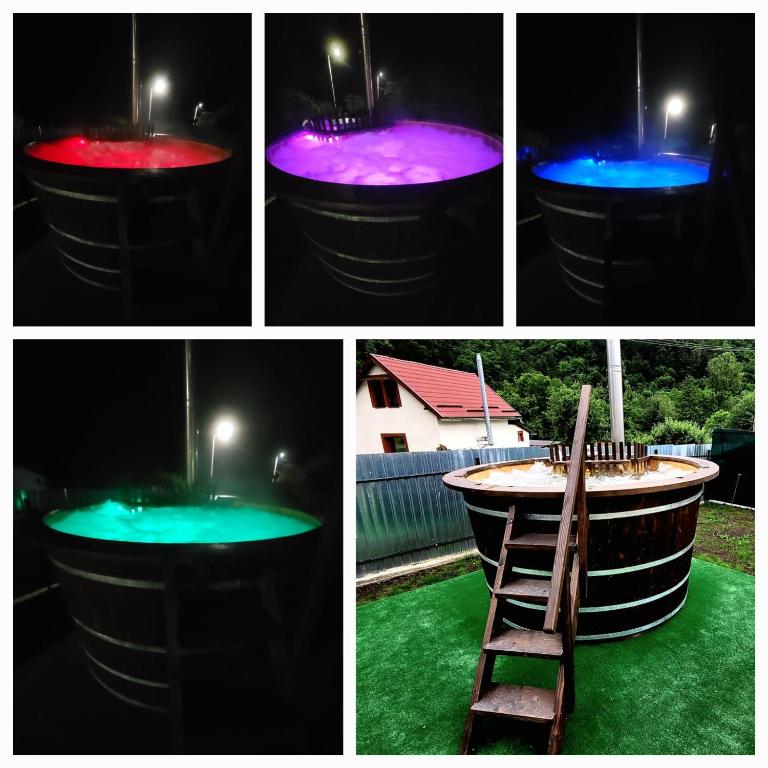a group of four different colored lights in a barrel at Carla House in Vidolm