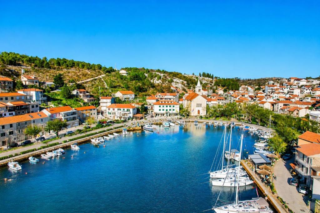 an aerial view of a harbor with boats in the water at Apartman Vida in Zaton