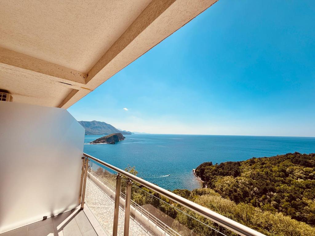 a balcony with a view of the ocean at Tophill Altezza 9 Breathtaking Views and Terrace in Budva
