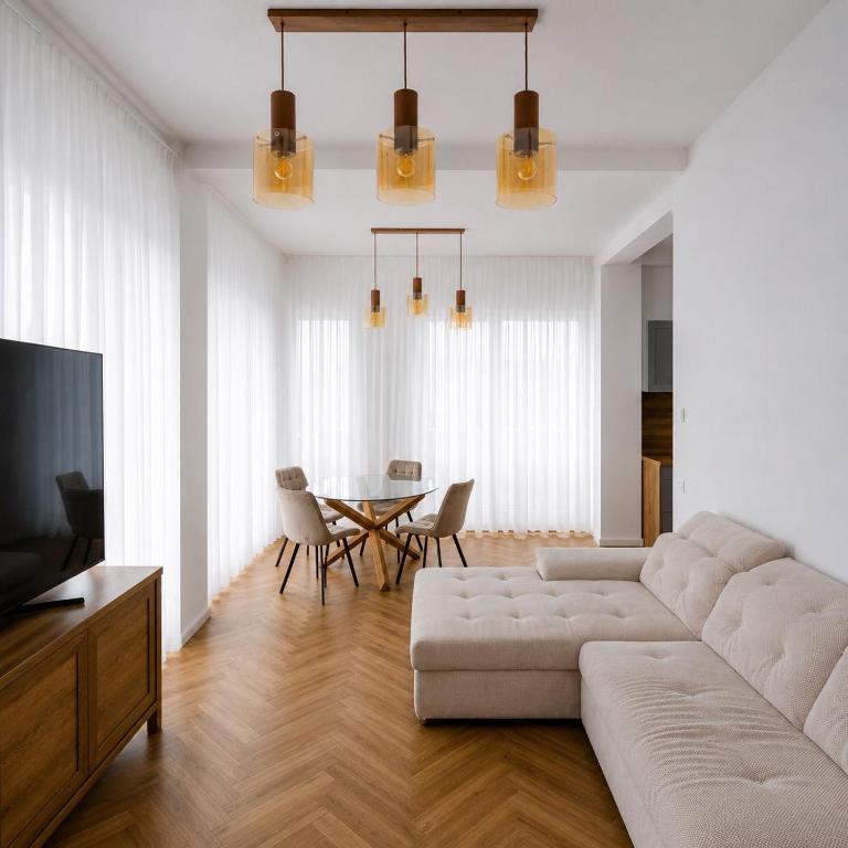 a living room with a couch and a table at Ayan Băile Felix Apartament in Baile Unu Mai