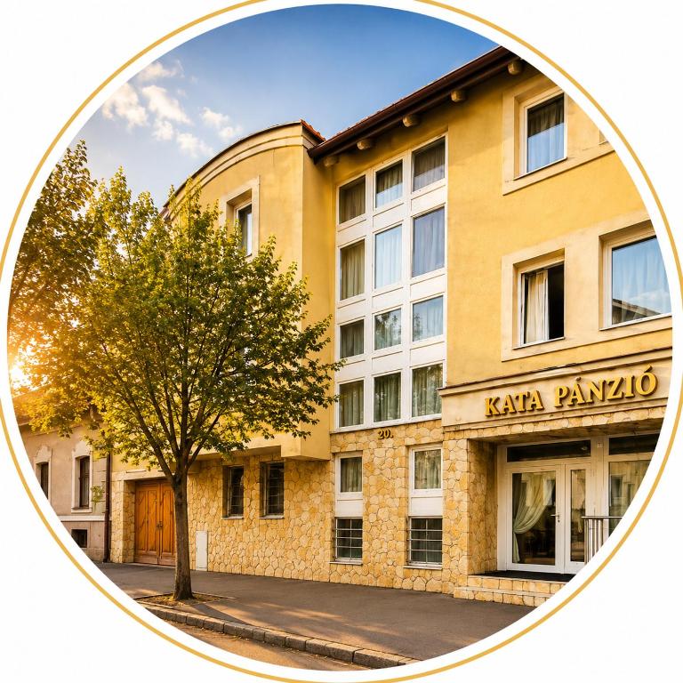 a building with a tree in front of it at Kata Panzió in Szeged