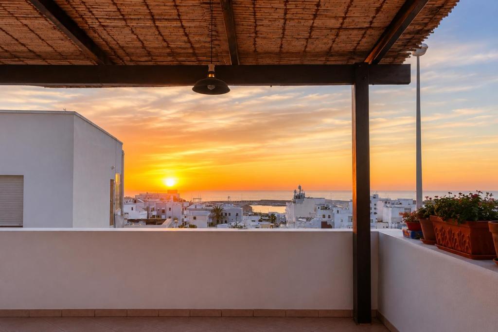 a sunset from the balcony of a building at La Casa Grande di Pantelleria - PNL HH in Pantelleria