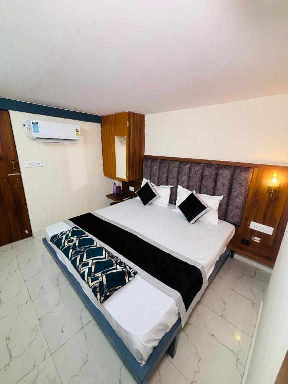 a bedroom with a large bed in a room at Nirvana Homestay in Mathura