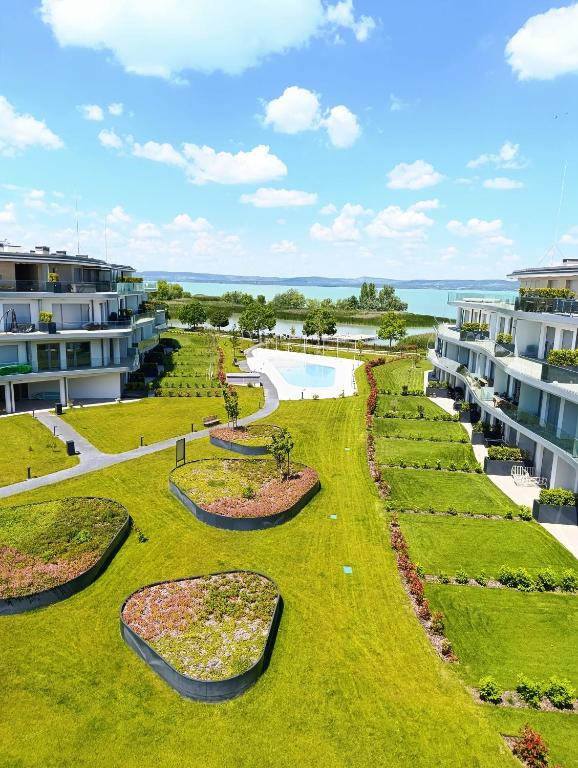 an aerial view of a resort yard with a pool at Szemesbay Serenity Apartman in Balatonszemes