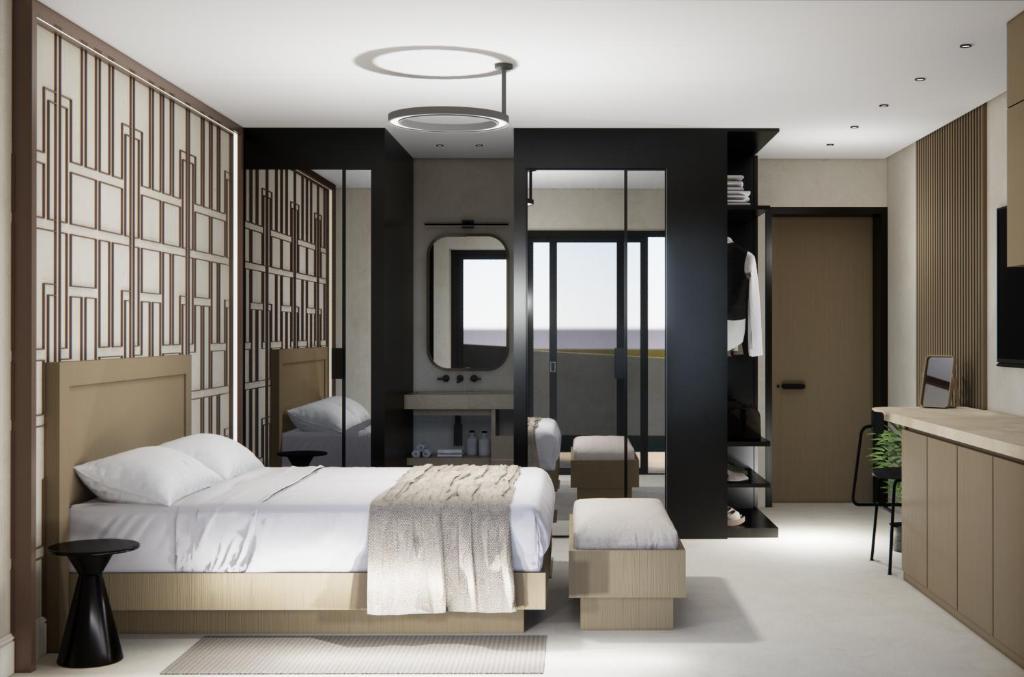 a bedroom with a bed and a bathroom at Nerion Hotel & Spa in Agia Marina Nea Kydonias