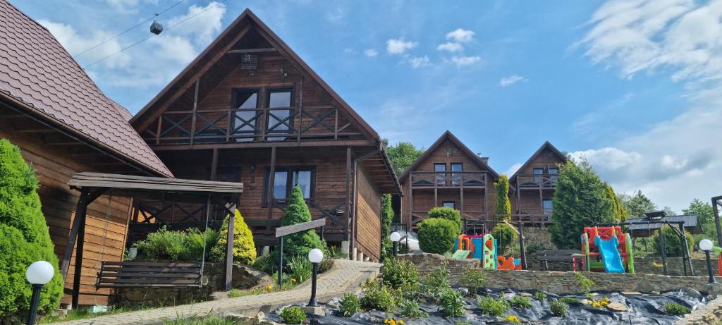 a row of wooden homes in a row at La Merveille 795-848-628 in Solina